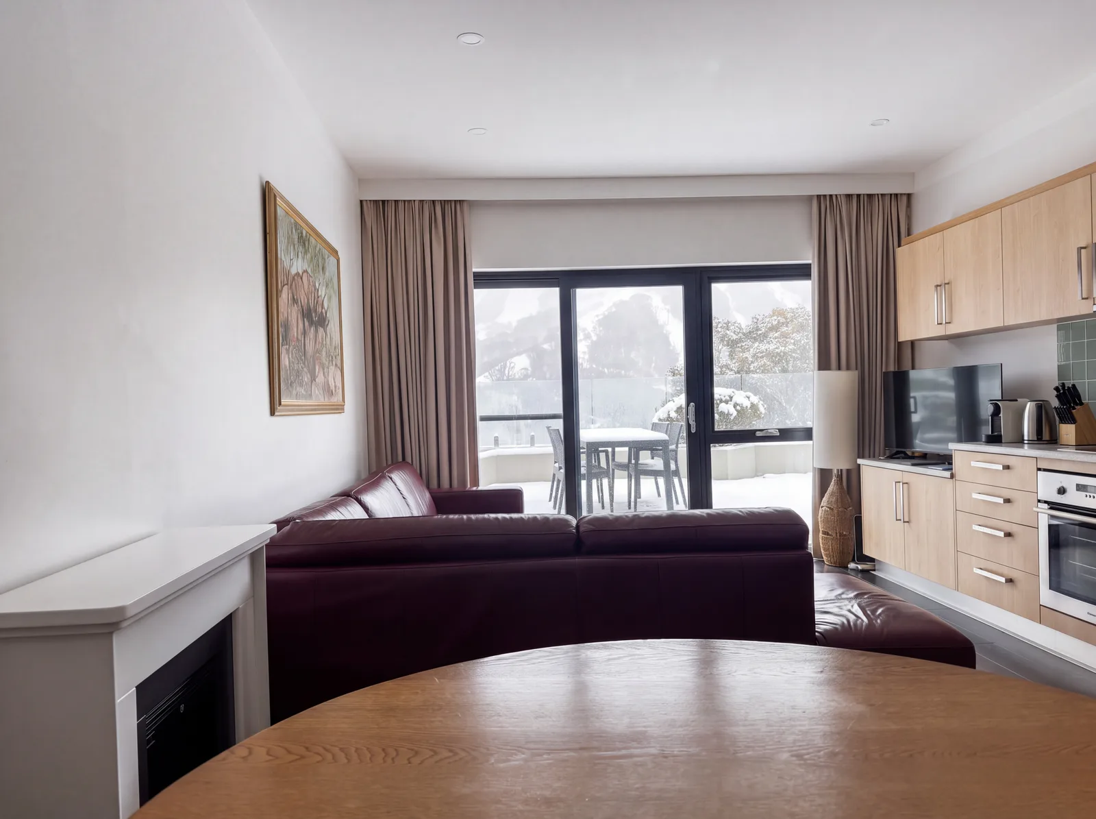 The living room with snow falling outside
